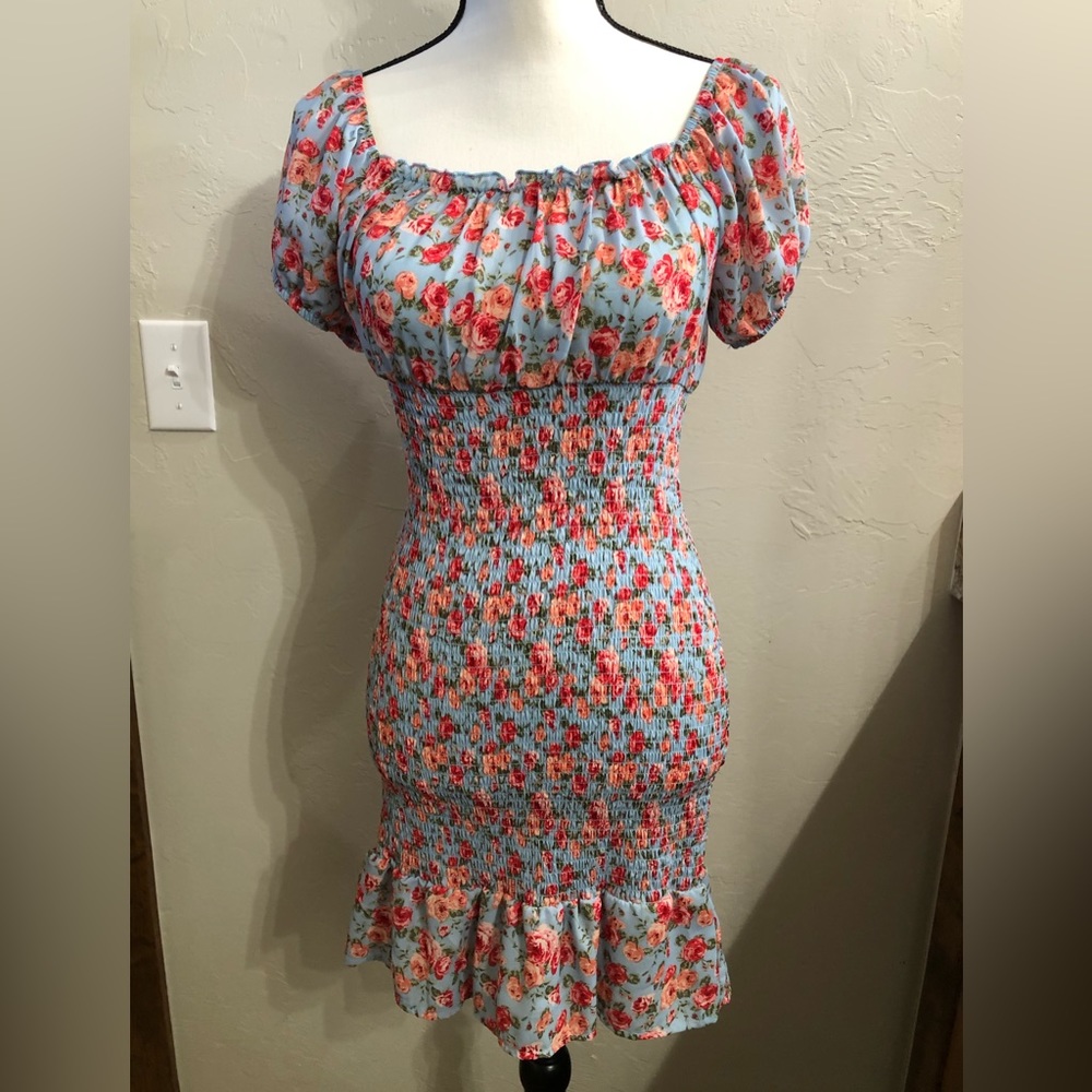 Dress with puff sleeve. Fits to the shape. Never been worn.